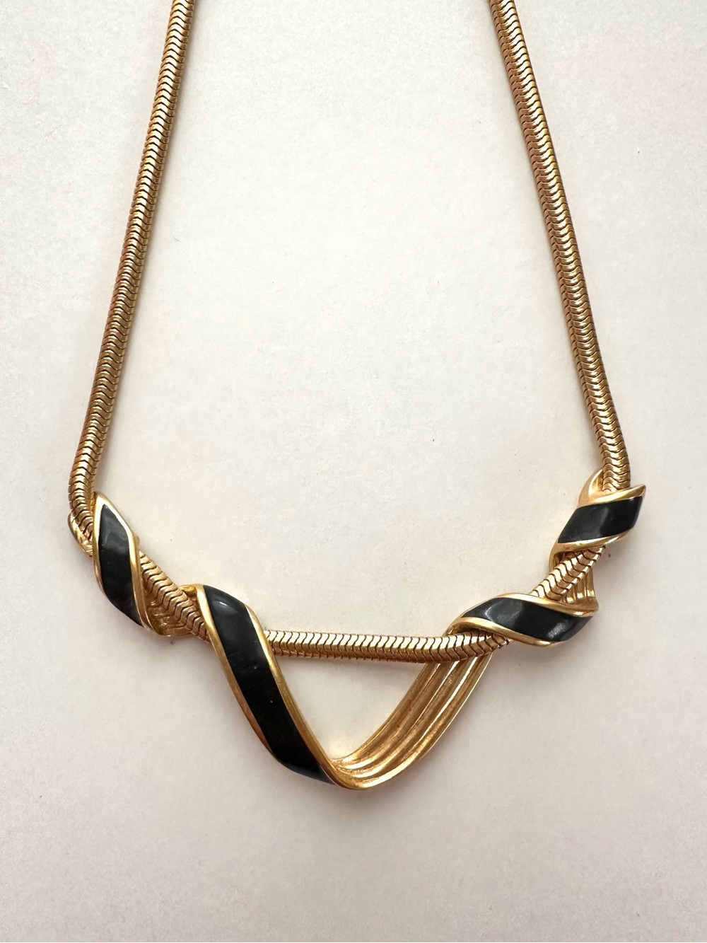 Vintage Monet Gold Tone Necklace with Black Enamel Ribbon Accent